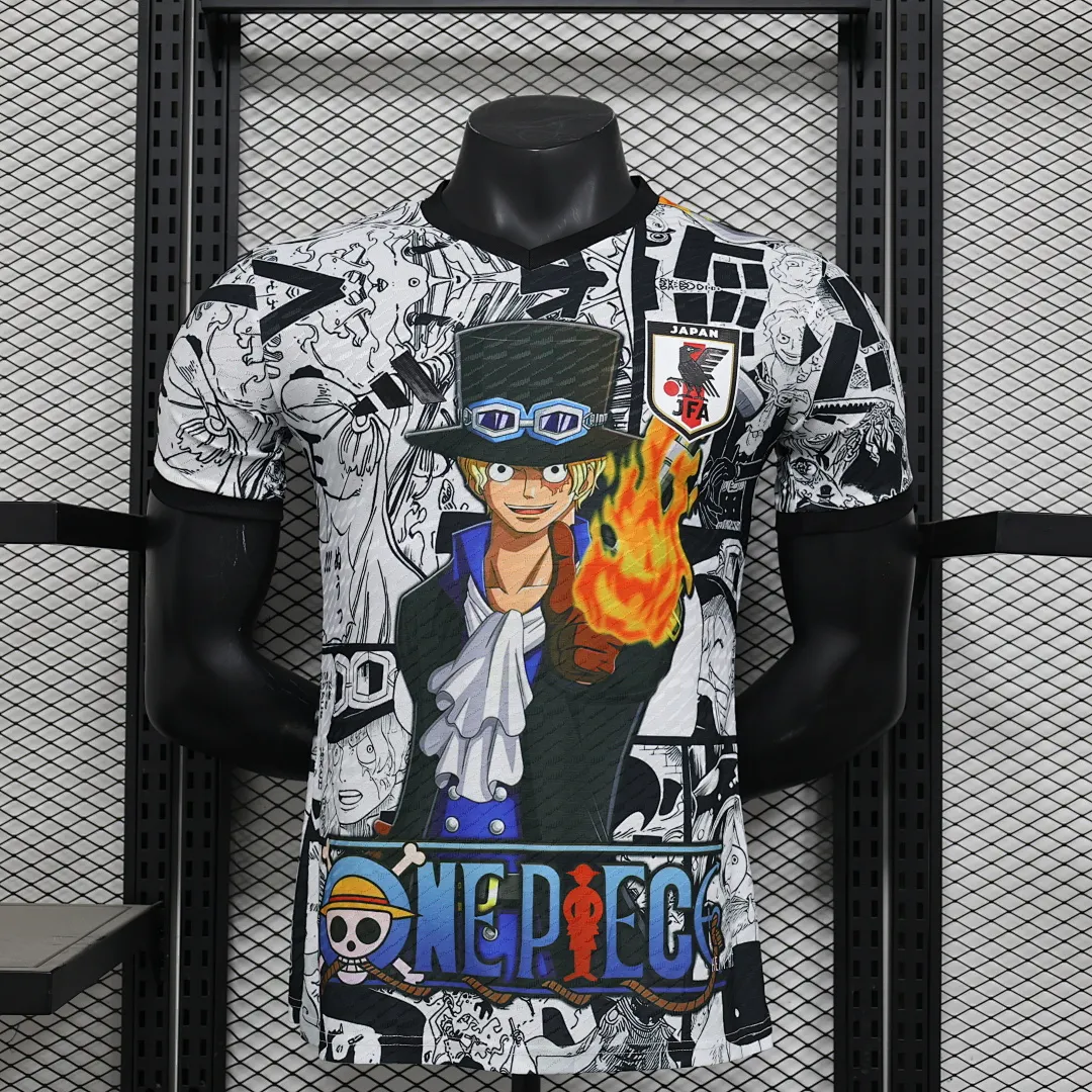 חולצת יפן מהדורה מיוחדת 2025/26 – עיצוב בהשראת One Piece – מנגה שחור־לבן, גרסת שחקן — חולצת כדורגל, חזית